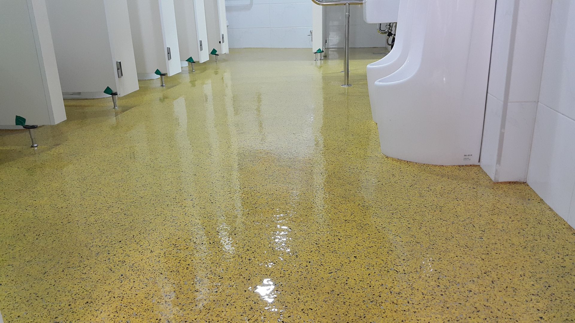 Glossy terrazzo restroom floor finish